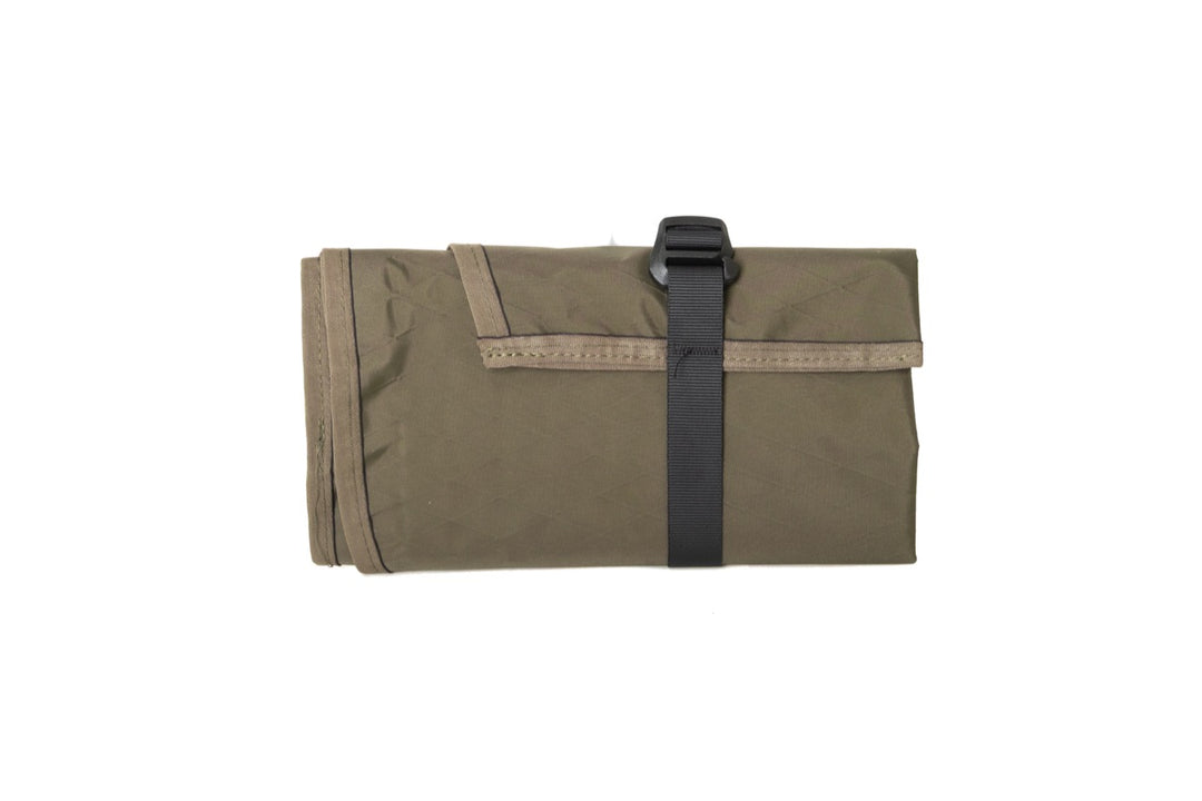 Suppressor Ready Rifle Cover folded and secured with an adjustable webbing strap.