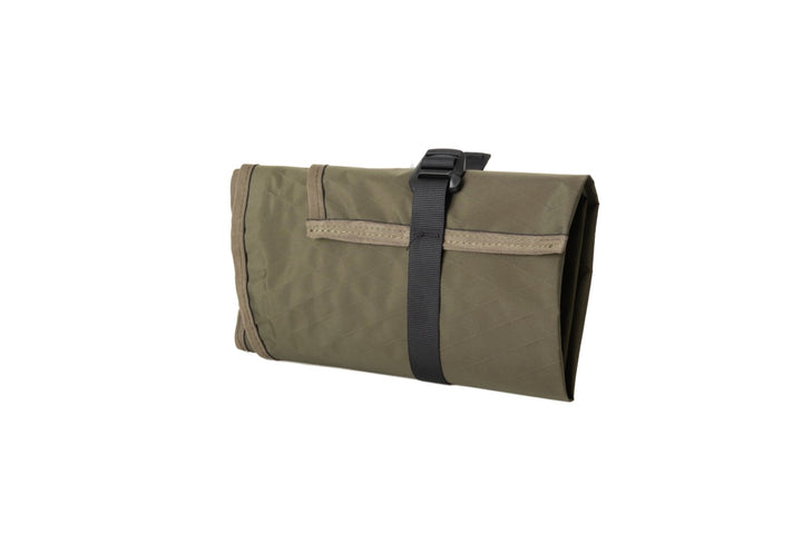 Folded Suppressor Ready Rifle Cover in olive green secured with an adjustable black webbing strap, shown at an angle.