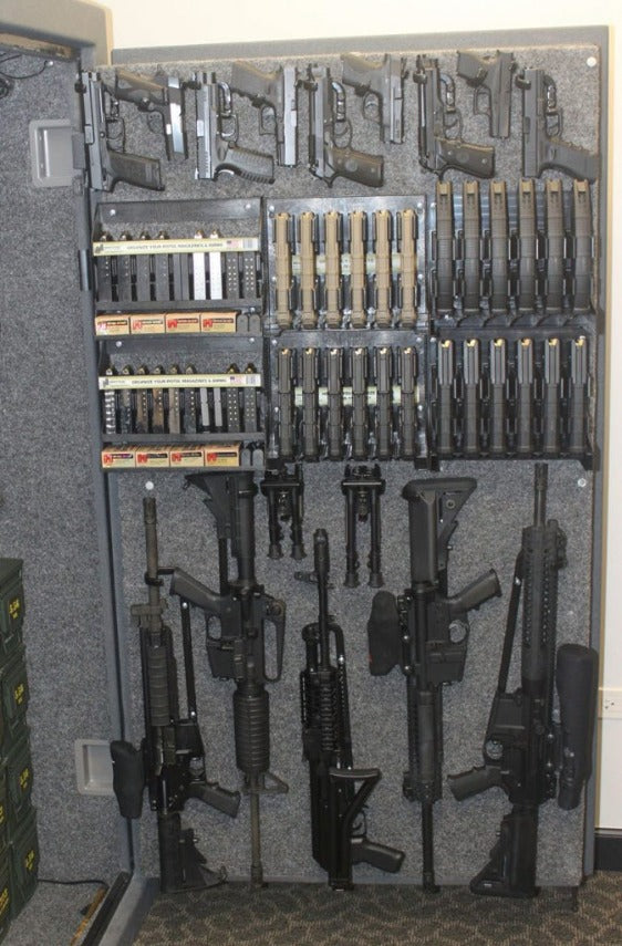 Safe door with dozens of weapons, bipods and magazine racks.  Pistol Mag Holder - Sharps Mountain - SharpsMountain.com