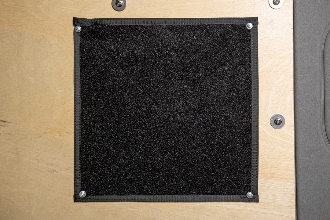 Pouch Mounting Panel 12x12" - Mounted to the inside wall of a vehicle with large headed screws