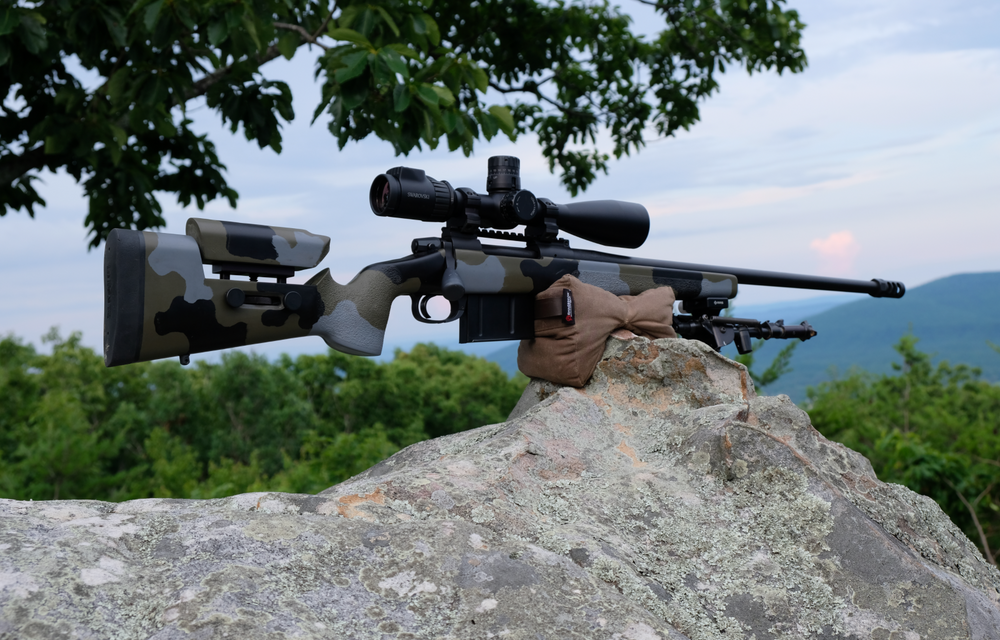 Close up of Armageddon Gear Pint Sized Gamechanger™ holding up a competition rifle. - Sharps Mountain - SharpsMountain.com